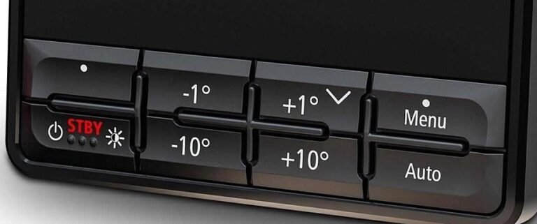 The two-key press the pilot expects: -1 and -10 together for port, +1 and +10 together for starboard. A Nauti-Control controller sends the tack for you, so you do not have to be standing here to do it.