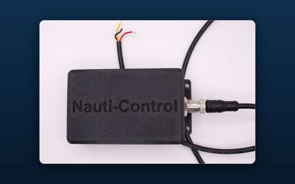 Nauti-Control ST Wireless controller with its red, black and yellow SeaTalk cable